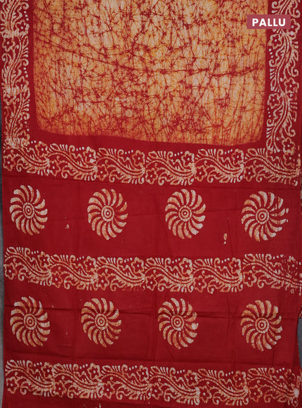 Batik cotton saree mustard yellow and red with allover prints and batik printed border