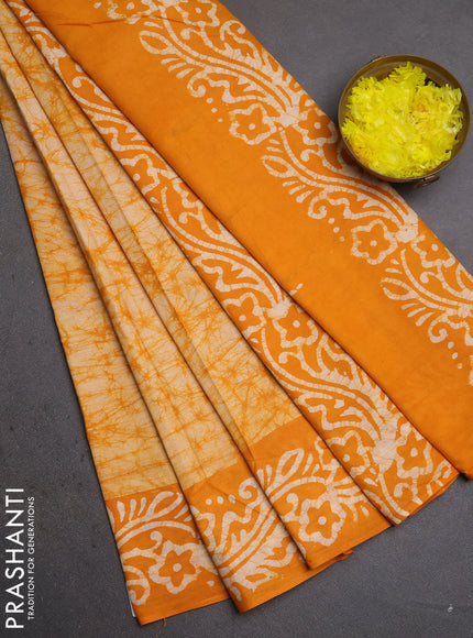 Batik cotton saree mango yellow with allover prints and batik printed border