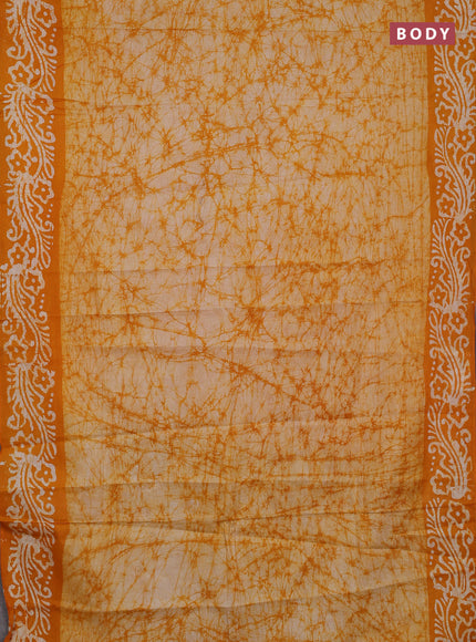 Batik cotton saree mango yellow with allover prints and batik printed border
