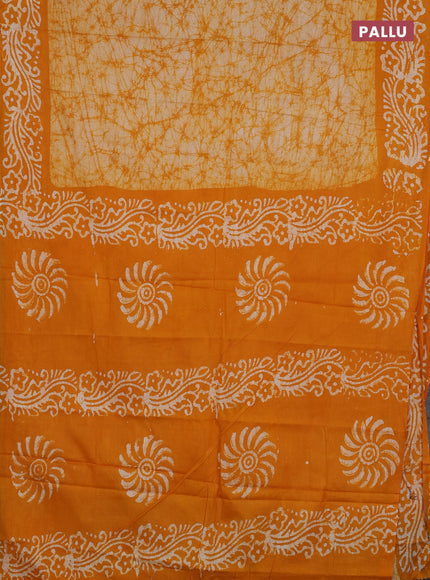 Batik cotton saree mango yellow with allover prints and batik printed border