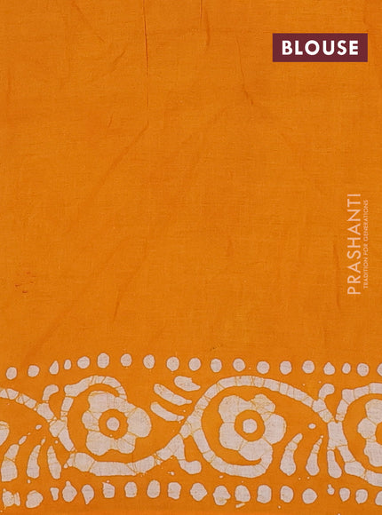 Batik cotton saree mango yellow with allover prints and batik printed border