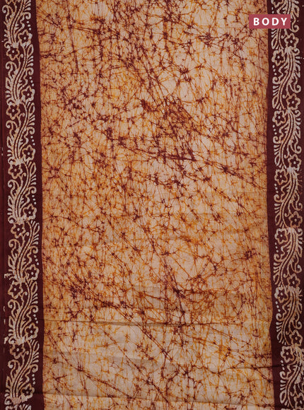 Batik cotton saree beige and deep maroon with allover prints and batik printed border