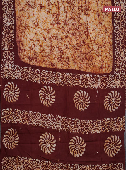 Batik cotton saree beige and deep maroon with allover prints and batik printed border