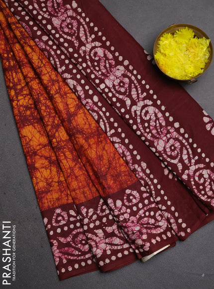 Batik cotton saree mango yellow and deep maroon with allover prints and batik printed border
