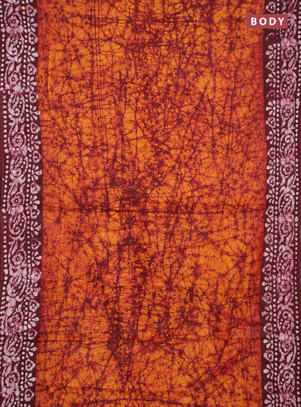 Batik cotton saree mango yellow and deep maroon with allover prints and batik printed border