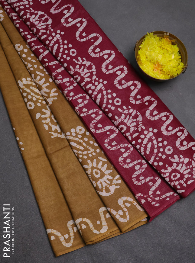 Batik cotton saree mustard green and magenta pink with allover prints and batik printed border