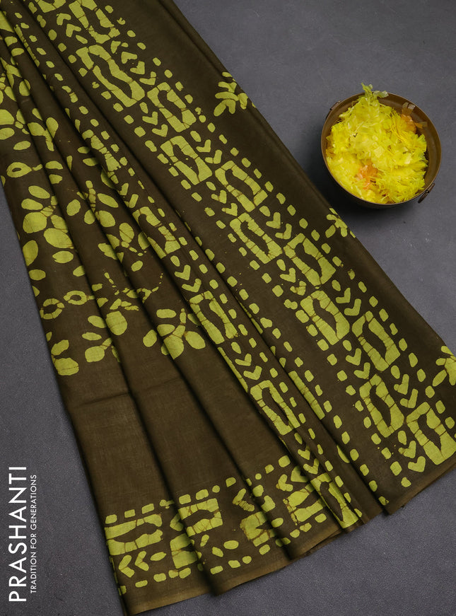 Batik cotton saree mehendi green with allover prints and batik printed border
