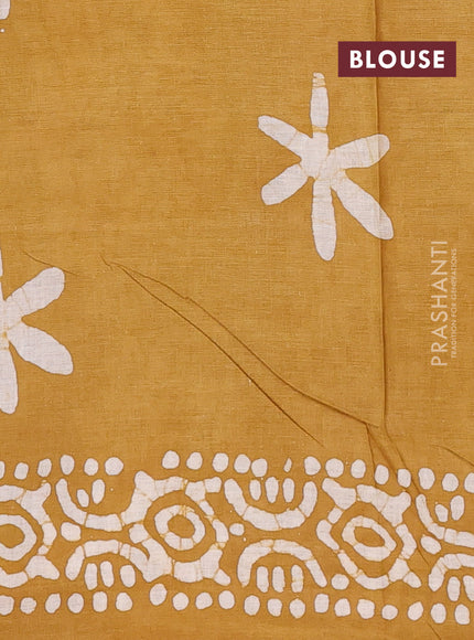 Batik cotton saree multi colour and mustared yellow with allover prints and batik printed border