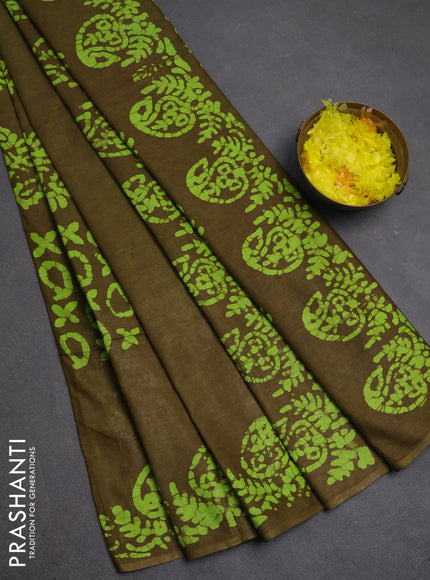Batik cotton saree mehendi green with allover prints and batik printed border