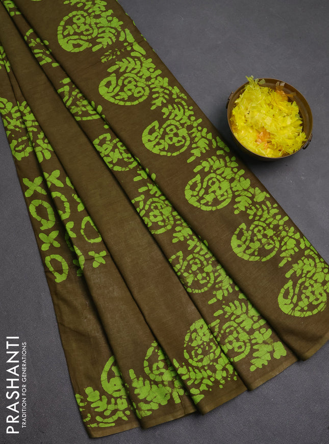 Batik cotton saree mehendi green with allover prints and batik printed border
