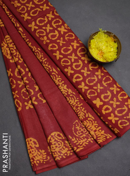 Batik cotton saree maroon and mustard yellow with allover prints and batik printed border