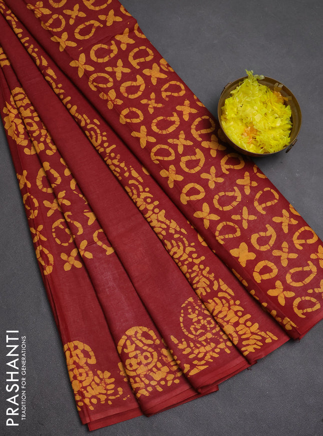 Batik cotton saree maroon and mustard yellow with allover prints and batik printed border