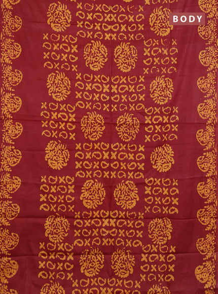 Batik cotton saree maroon and mustard yellow with allover prints and batik printed border