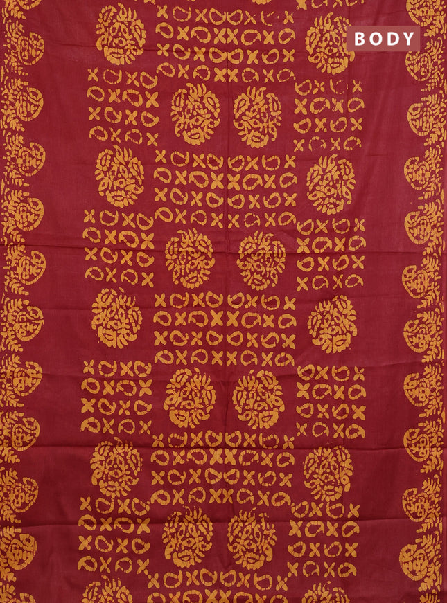 Batik cotton saree maroon and mustard yellow with allover prints and batik printed border