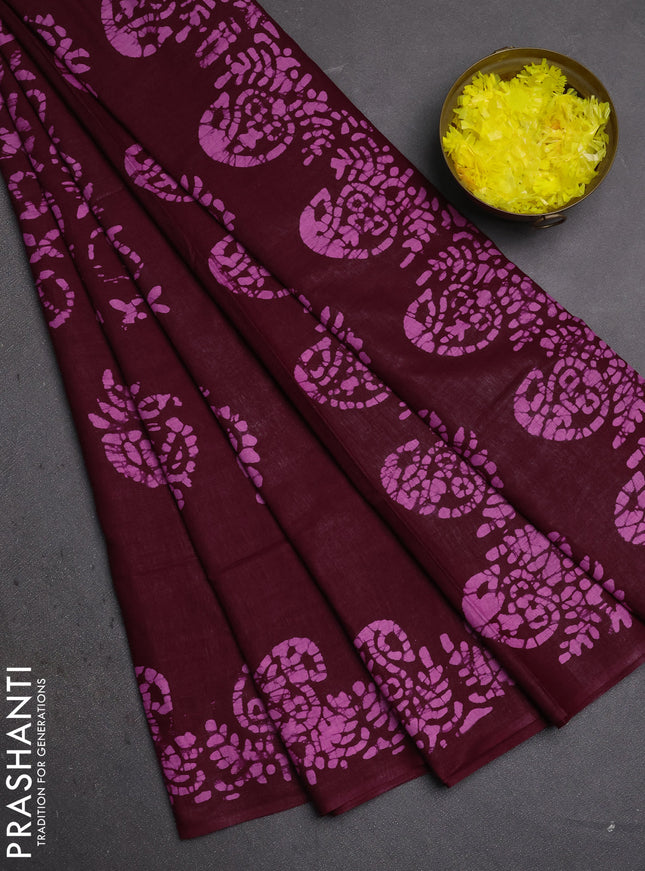 Batik cotton saree wine shade with allover prints and batik printed border