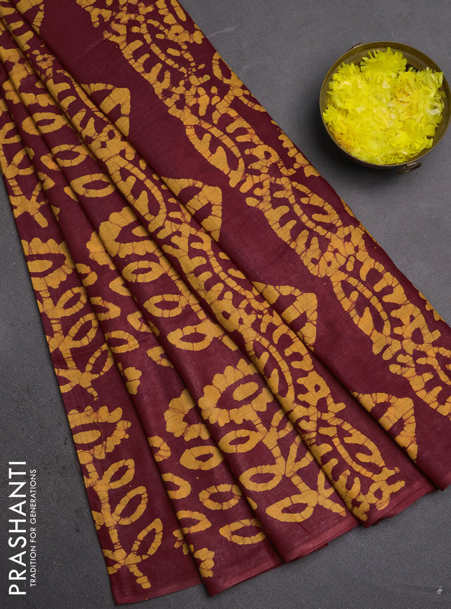 Batik cotton saree maroon and mustard yellow with allover batik prints in borderless style