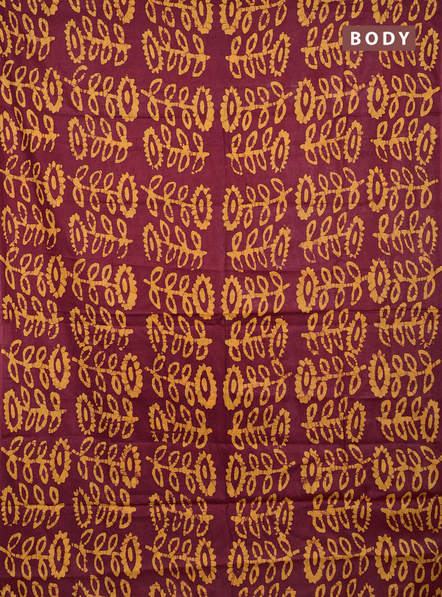 Batik cotton saree maroon and mustard yellow with allover batik prints in borderless style