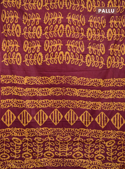 Batik cotton saree maroon and mustard yellow with allover batik prints in borderless style