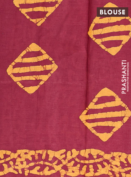 Batik cotton saree maroon and mustard yellow with allover batik prints in borderless style