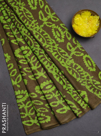Batik cotton saree mehendi green and fluorescent green with allover batik prints in borderless style