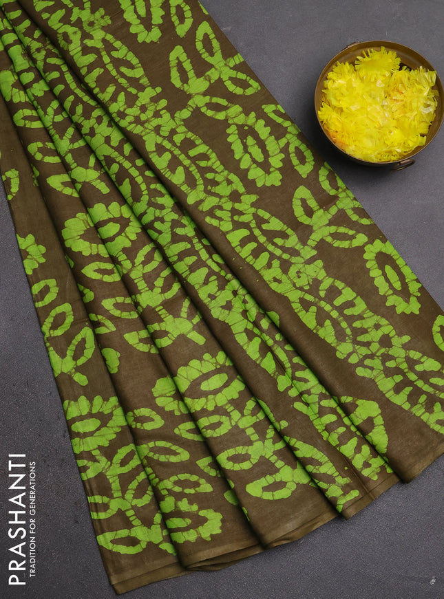 Batik cotton saree mehendi green and fluorescent green with allover batik prints in borderless style