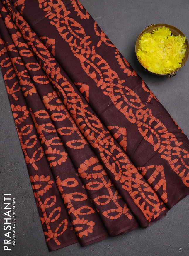 Batik cotton saree deep maroon and rust shade with allover batik prints in borderless style