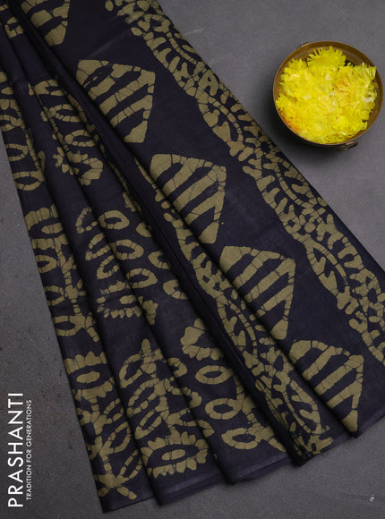 Batik cotton saree black and mehendi green with allover batik prints in borderless style