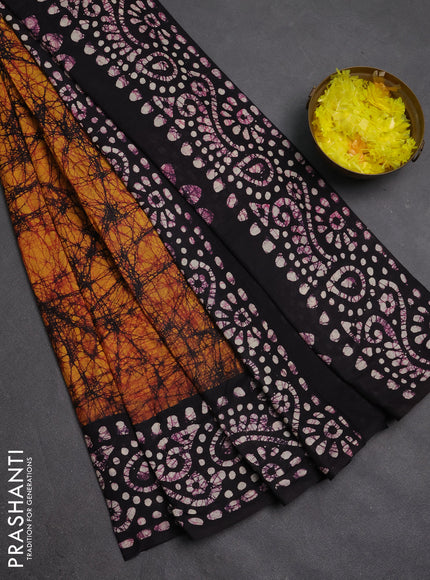 Batik cotton saree dark mustard and jamun shade with allover prints and batik printed border