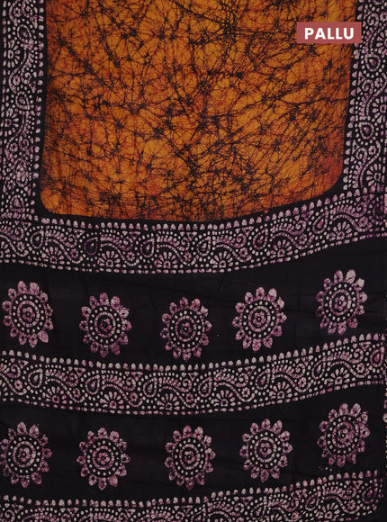 Batik cotton saree dark mustard and jamun shade with allover prints and batik printed border