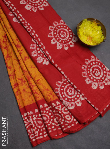Batik cotton saree mustard yellow and red with allover prints and batik printed border