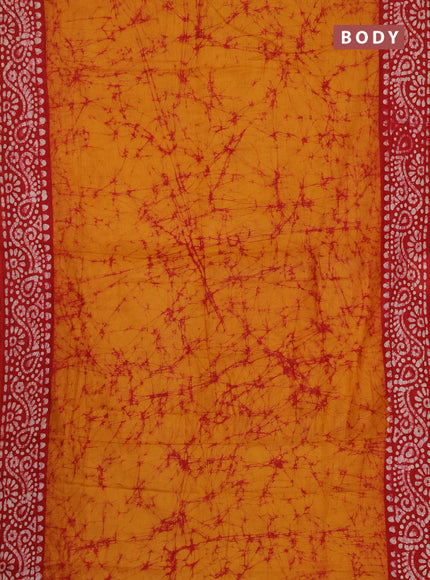 Batik cotton saree mustard yellow and red with allover prints and batik printed border