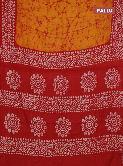 Batik cotton saree mustard yellow and red with allover prints and batik printed border