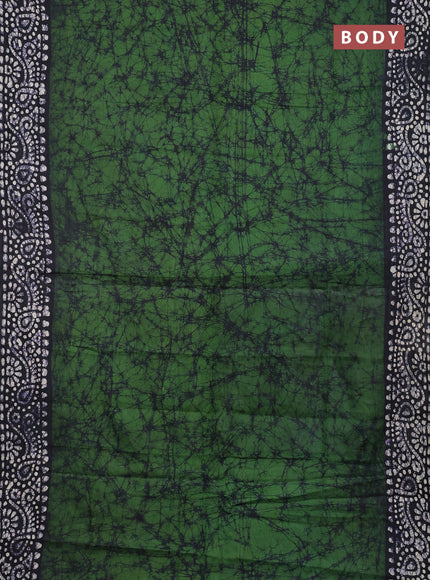 Batik cotton saree bottle green and black with allover prints and batik printed border
