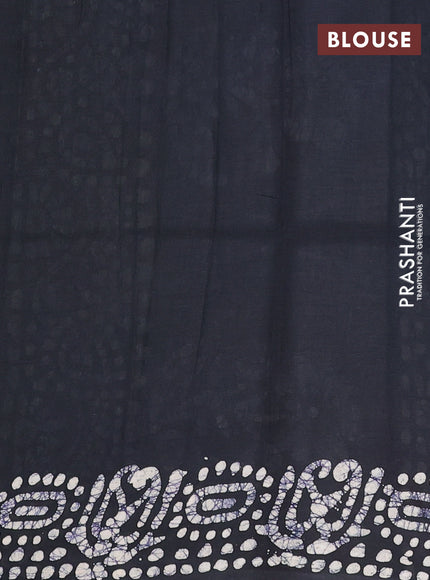 Batik cotton saree bottle green and black with allover prints and batik printed border