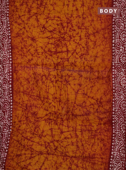 Batik cotton saree mustard yellow and red with allover prints and batik printed border