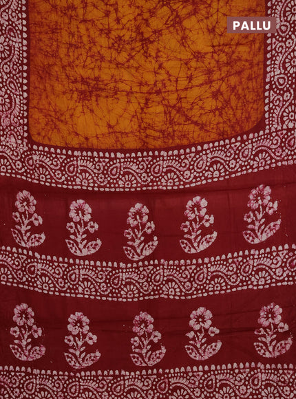 Batik cotton saree mustard yellow and red with allover prints and batik printed border