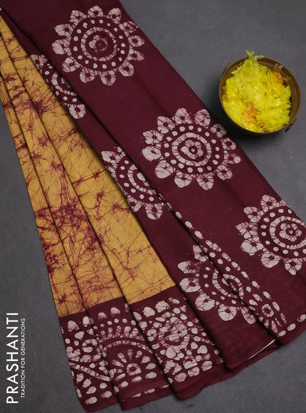 Batik cotton saree mustard yellow and deep wine shade with allover prints and batik printed border