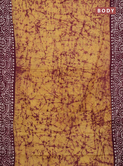 Batik cotton saree mustard yellow and deep wine shade with allover prints and batik printed border