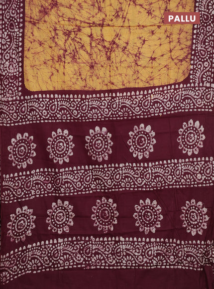 Batik cotton saree mustard yellow and deep wine shade with allover prints and batik printed border