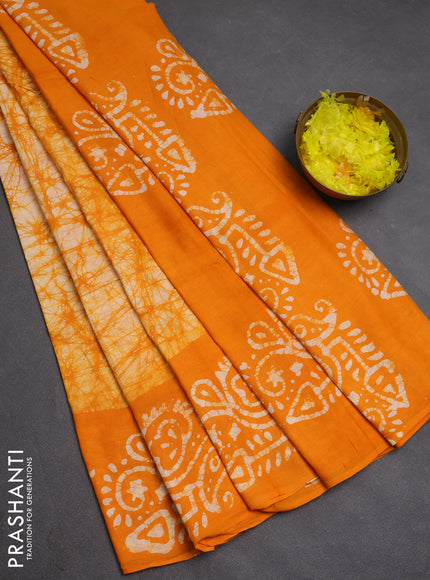 Batik cotton saree mango yellow with allover prints and batik printed border