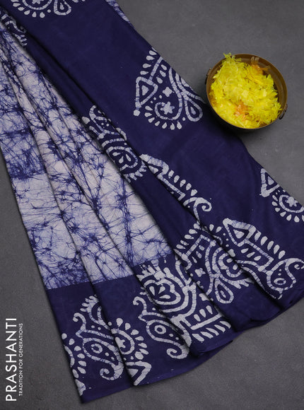 Batik cotton saree off white and navy blue with allover prints and batik printed border