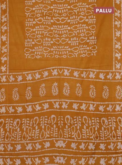 Batik cotton saree mustard yellow with allover prints and batik printed border