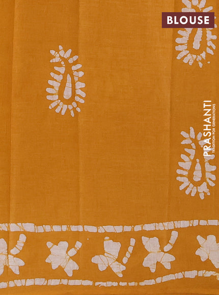 Batik cotton saree mustard yellow with allover prints and batik printed border