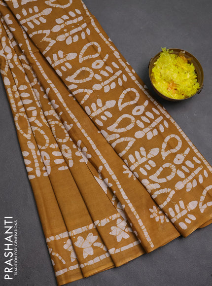 Batik cotton saree mustard yellow with allover prints and batik printed border