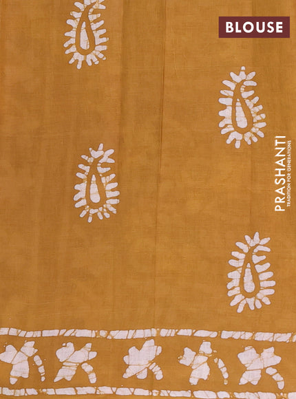 Batik cotton saree mustard yellow with allover prints and batik printed border