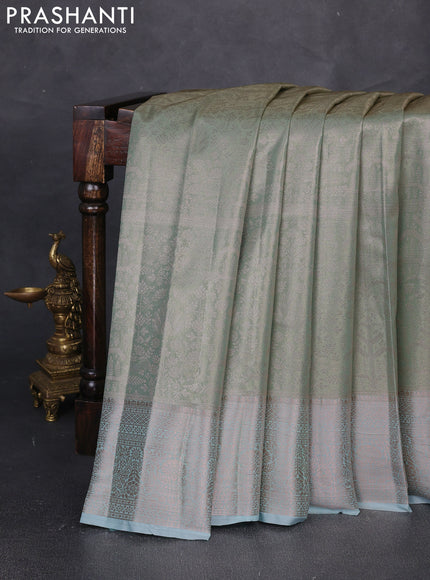 Bangalori tissue silk saree teal green with allover zari woven brocade weaves and zari woven border