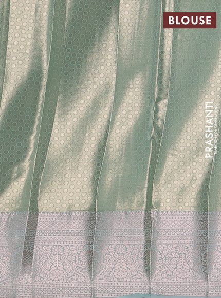 Bangalori tissue silk saree teal green with allover zari woven brocade weaves and zari woven border