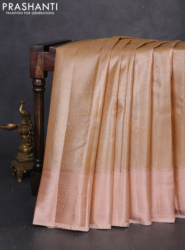 Bangalori tissue silk saree mustard and peach with allover zari woven brocade weaves and long zari woven border