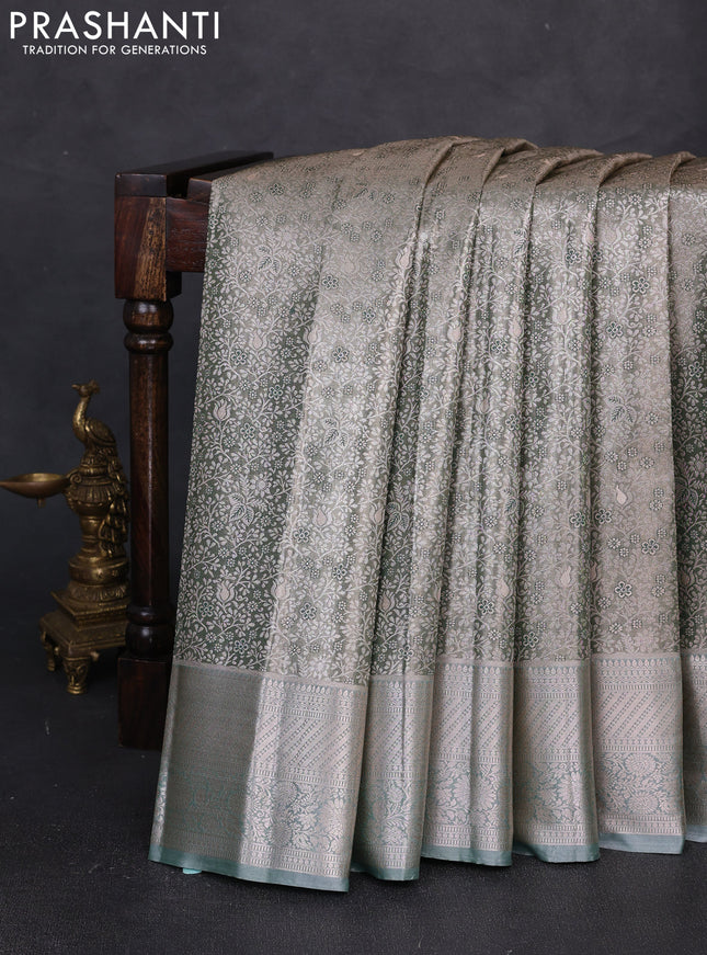 Bangalori tissue silk saree pastel green with allover zari woven brocade weaves and long zari woven border