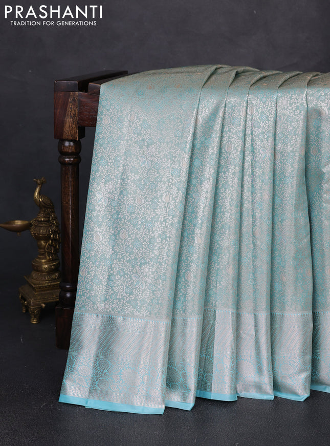 Bangalori tissue silk saree teal blue with allover zari woven brocade weaves and long zari woven border